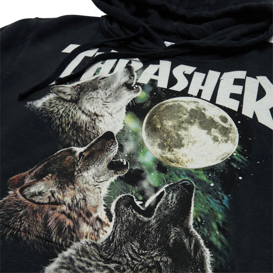 Black hoodie with graphic of three wolves howling at a moon and 'Thrasher' branding.