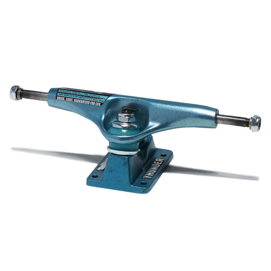 A single skateboard truck in a metallic teal blue finish, shown from a three-quarters perspective on a clean white background with a soft shadow.