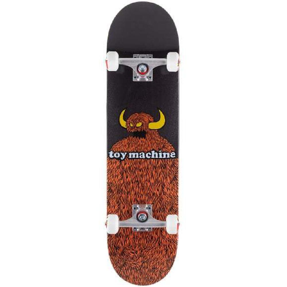 Skateboard with a black and brown design featuring a bear and 'toy machine' text on a white background.