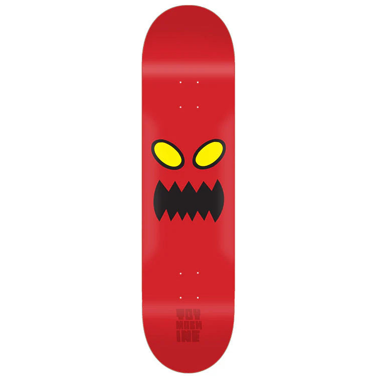 Red skateboard deck with a angry face design on a white background