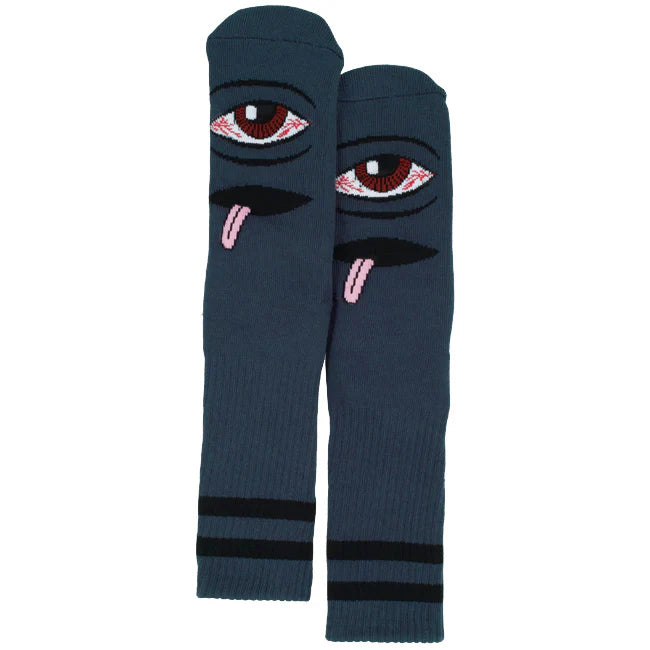 Pair of dark blue socks with eye and tongue design on a white background