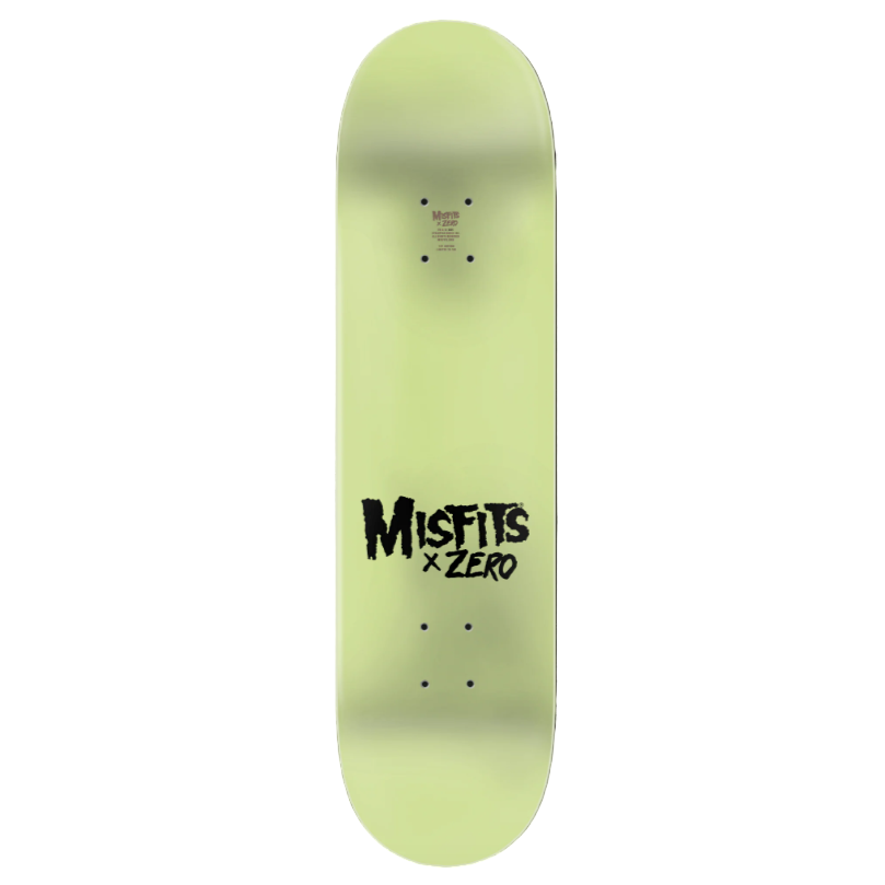 Glow-in-the-dark skateboard deck with 'Misfits x Zero' branding on a black background