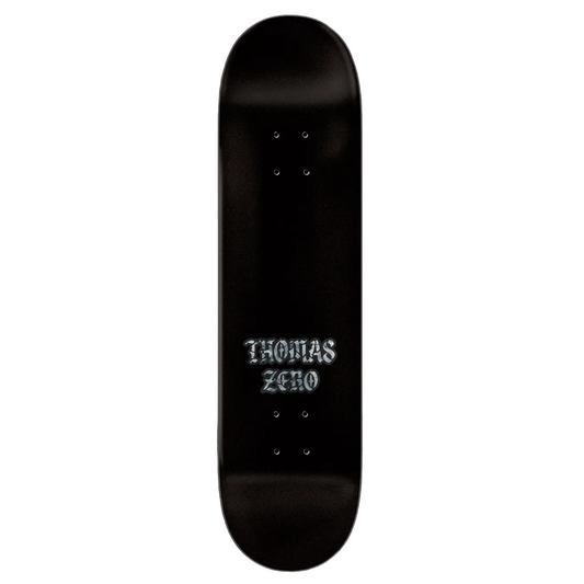 Black skateboard deck with 'THOMAS ZERO' branding on a black background