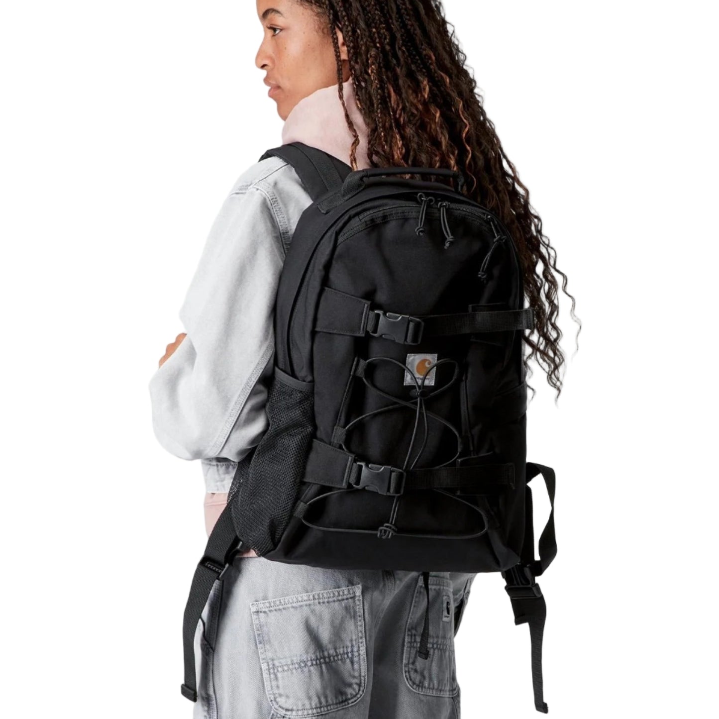 Person wearing a black backpack on a white background