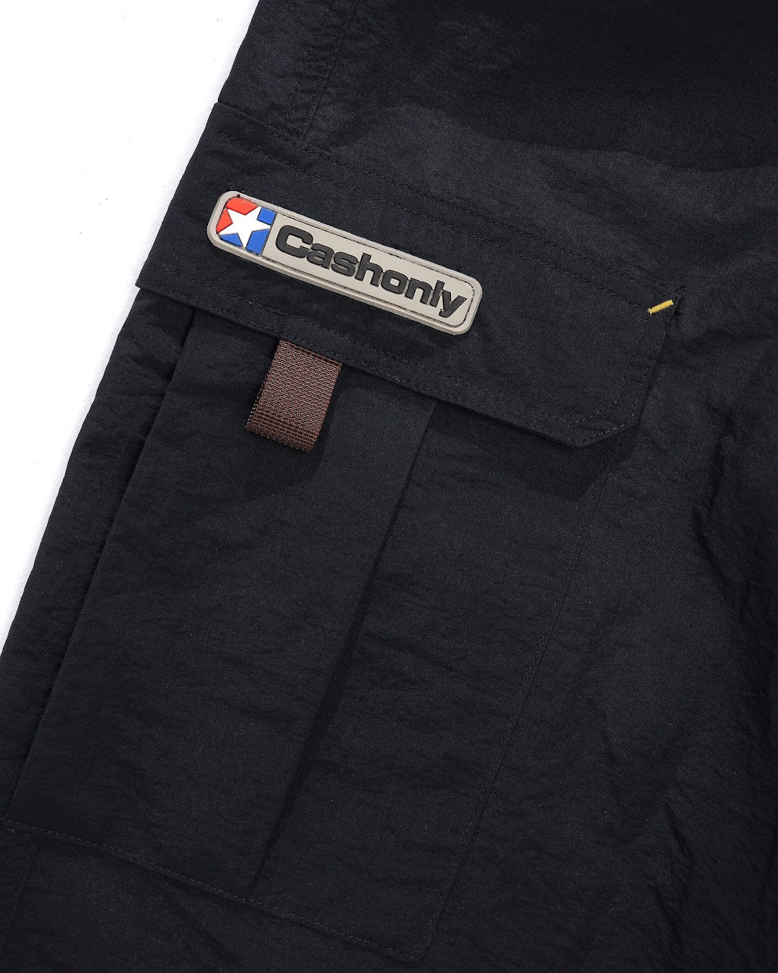 Black pants with a visible brand logo on a white background