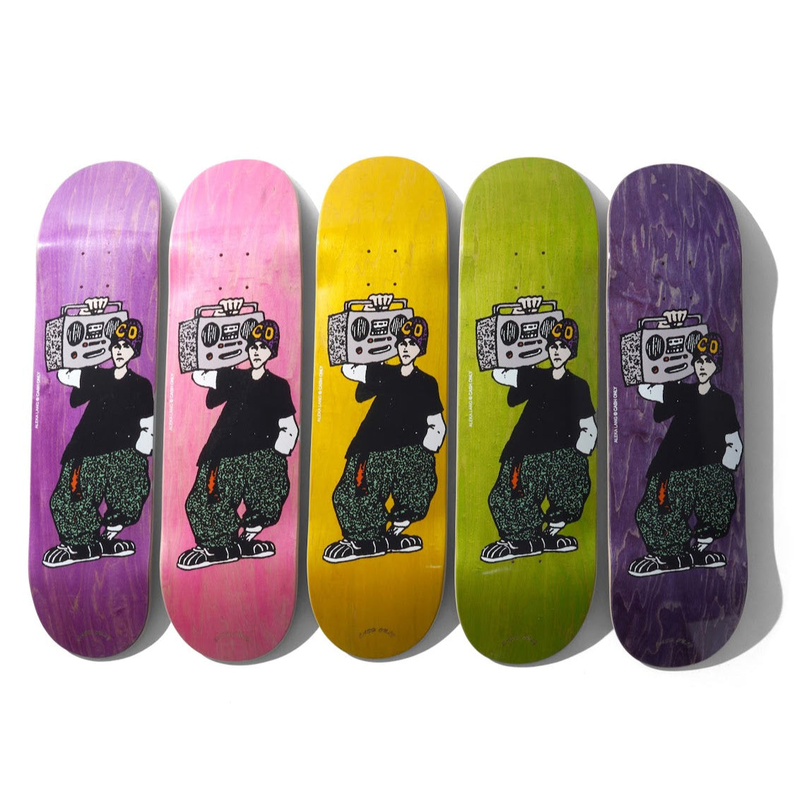 Five colorful skateboard decks with a cartoon character design on a white background