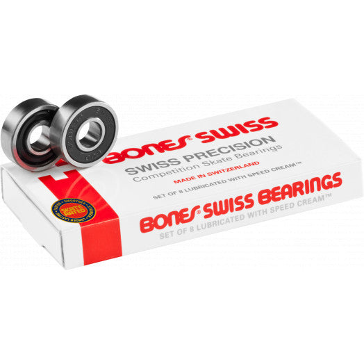 A set of Bones Swiss skateboard bearings displayed next to their packaging, which features the brand's colors and logo.