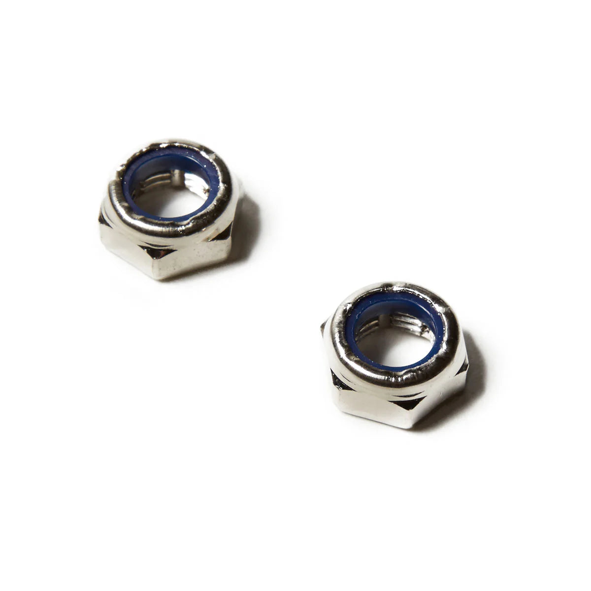 Two metallic hex nuts on a white background