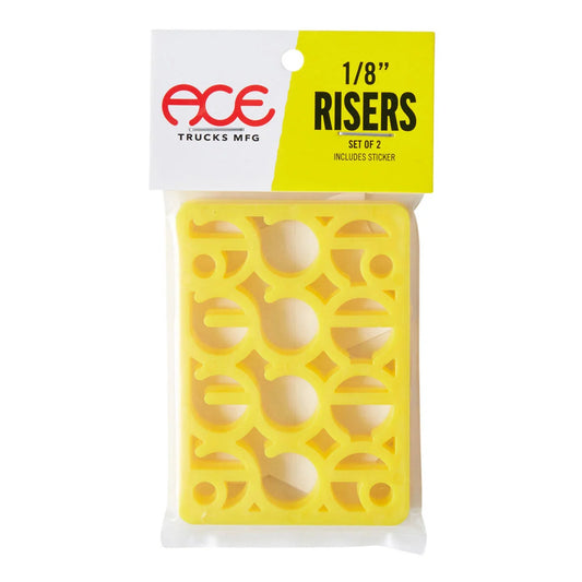 A packaged set of two yellow truck risers by ACE Trucks Mfg. The product is shown in its clear plastic blister packaging with a white and yellow cardboard header card.