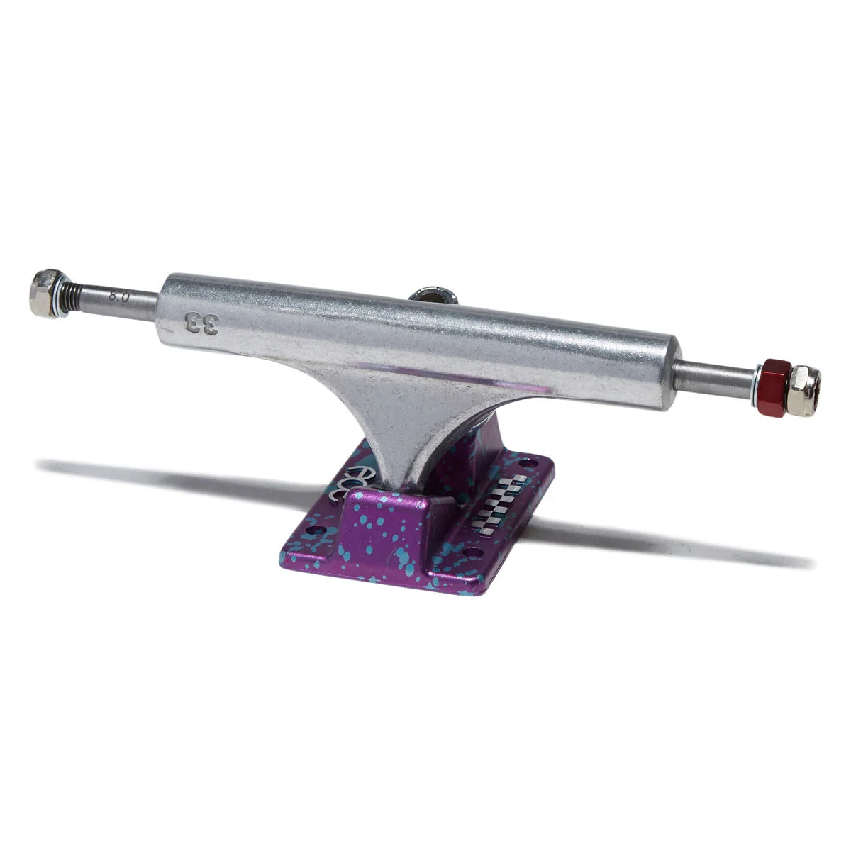 A single skateboard truck with a metallic silver chrome hardware and a purple anodized baseplate decorated with small blue and pink dots, shown on a white background with a soft shadow.