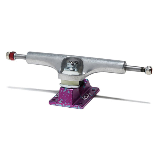A single skateboard truck with a silver metal hardware assembly and a purple anodized base plate with silver speckling, shown on a white background.