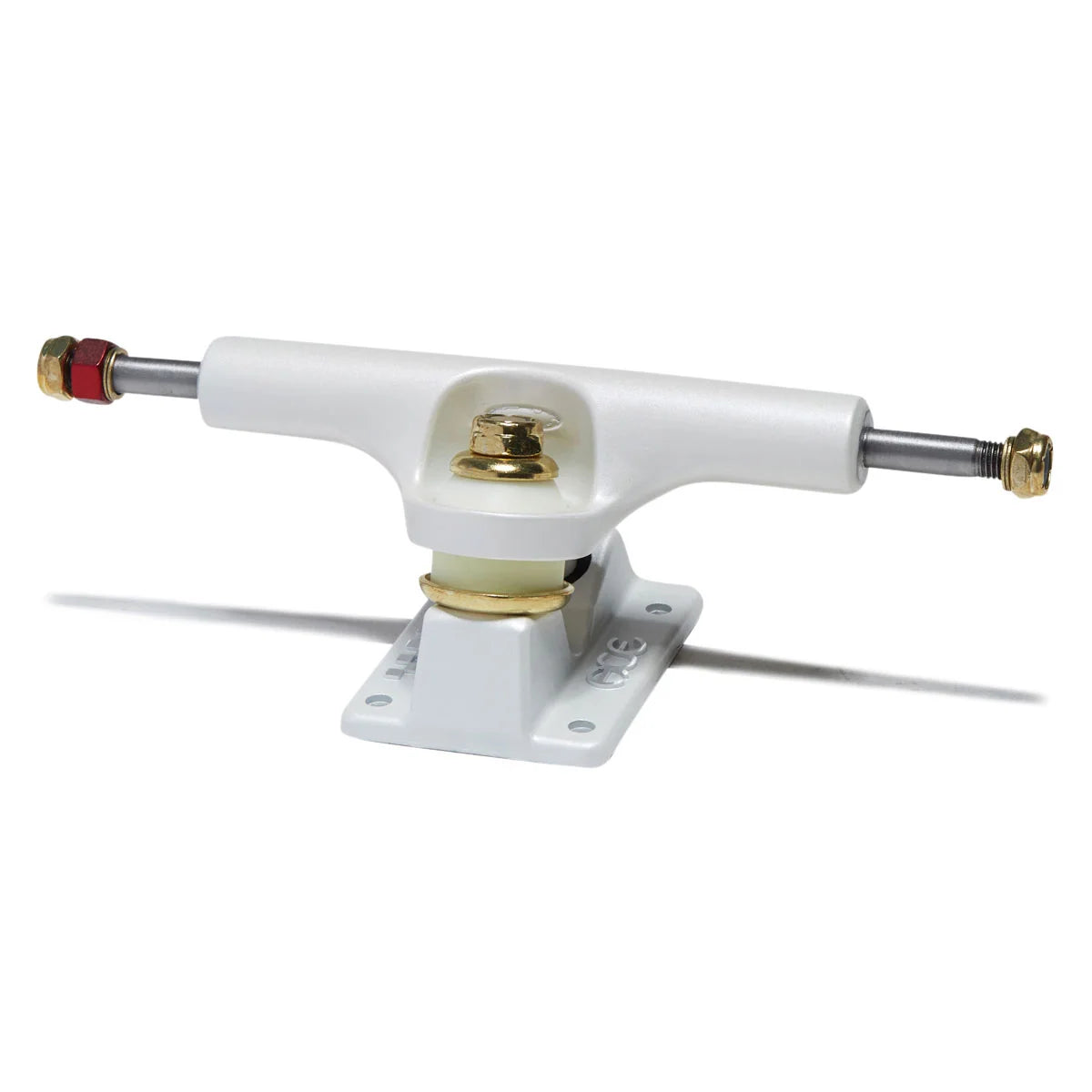 A single white skateboard truck with a white baseplate, featuring gold-toned hardware, a silver axle, and red and gold end caps, shown on a white background with a soft shadow.