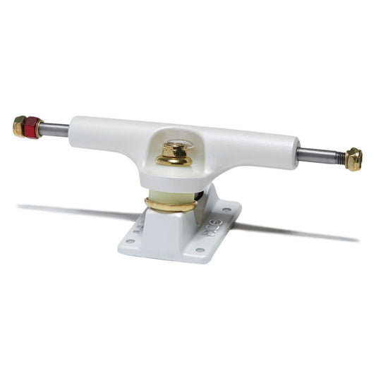 A single white skateboard truck with a white baseplate, featuring gold-toned hardware, a silver axle, and red and gold end caps, shown on a white background with a soft shadow.