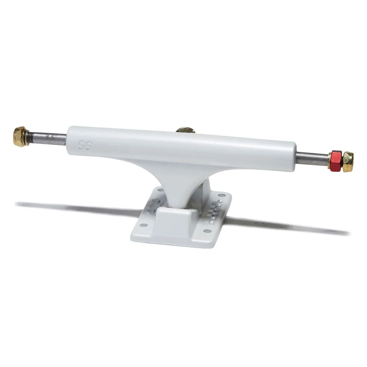 A single white skateboard truck with a white baseplate, featuring a silver metal axle with brass-colored end caps and a red locknut, shown against a plain white background.
