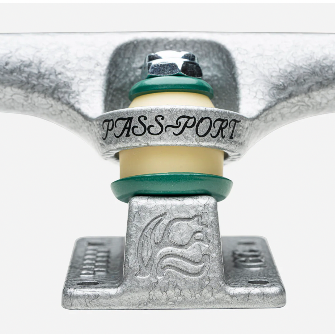 Close-up of a skateboard truck with 'PASS~PORT' branding on a white background