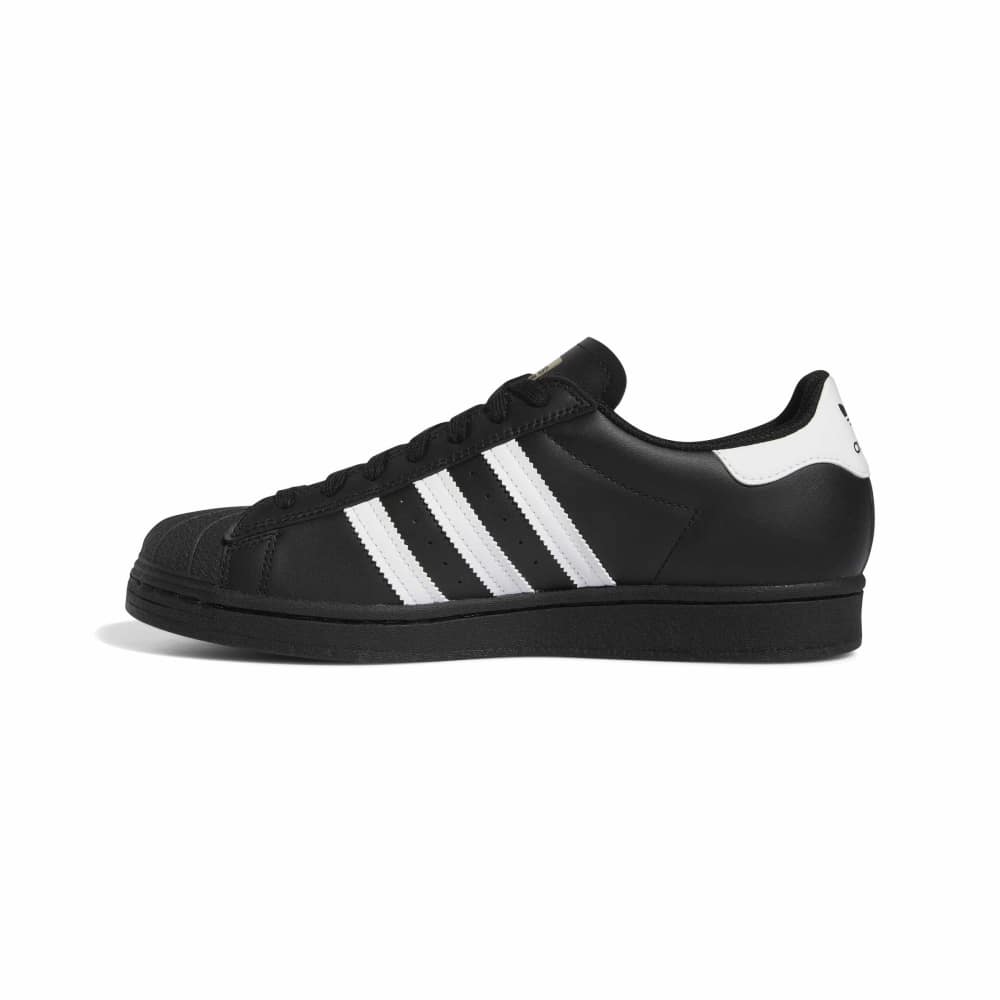 Black Adidas sneaker with white stripes on a white background