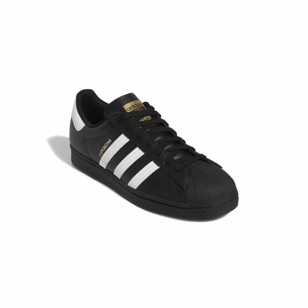 Black Adidas sneaker with white stripes on a white background