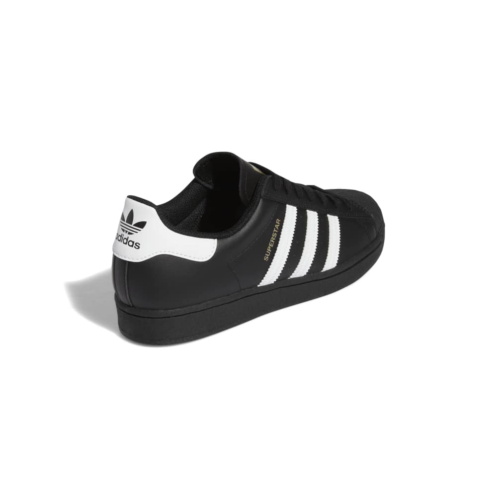 Black Adidas sneaker with white stripes on a white background
