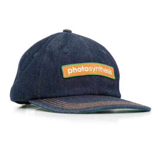 Blue cap with 'photosynthesis' logo on a white background