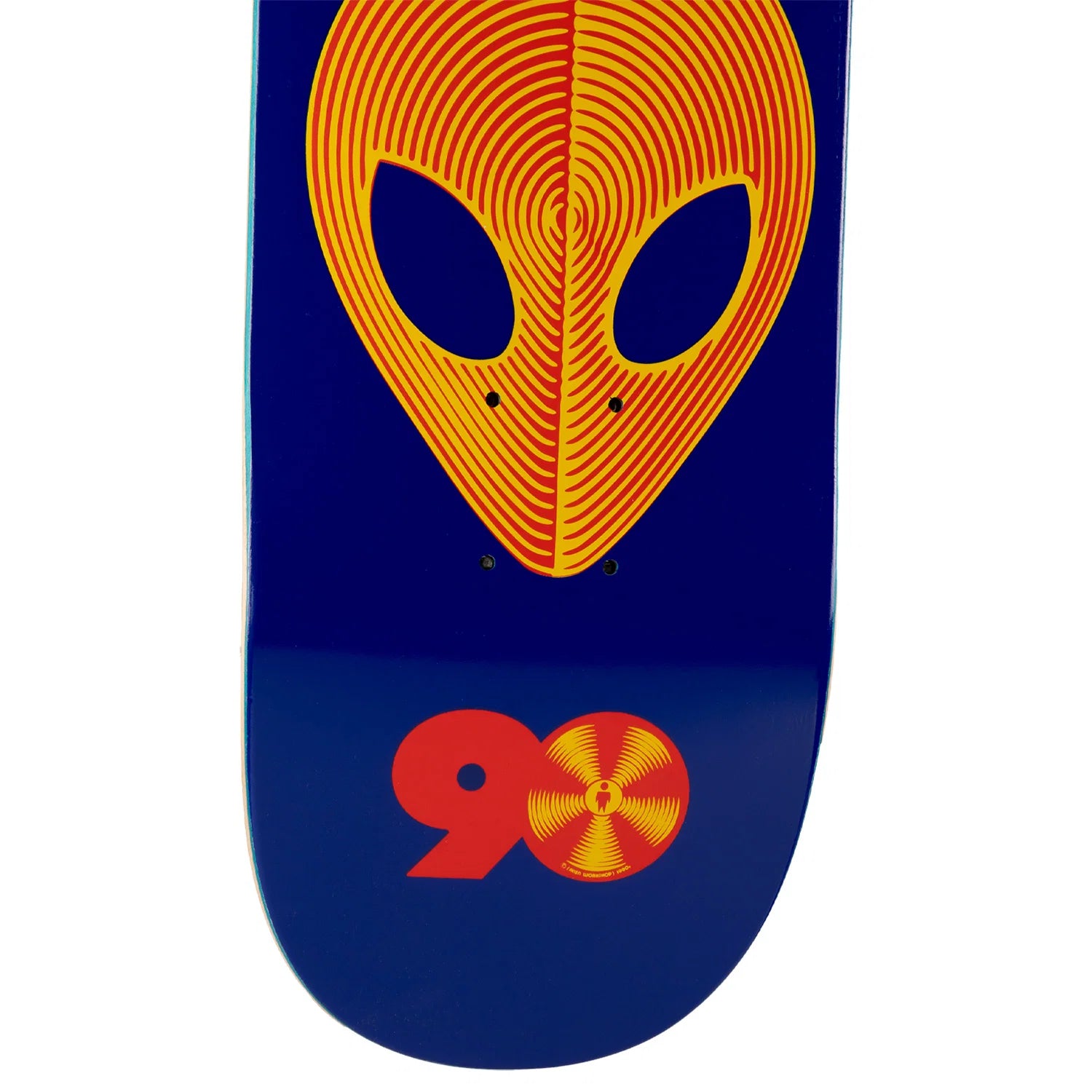 A skateboard deck featuring a dark blue background with a large yellow and orange alien head graphic on the top and a red and yellow '90' graphic on the bottom.