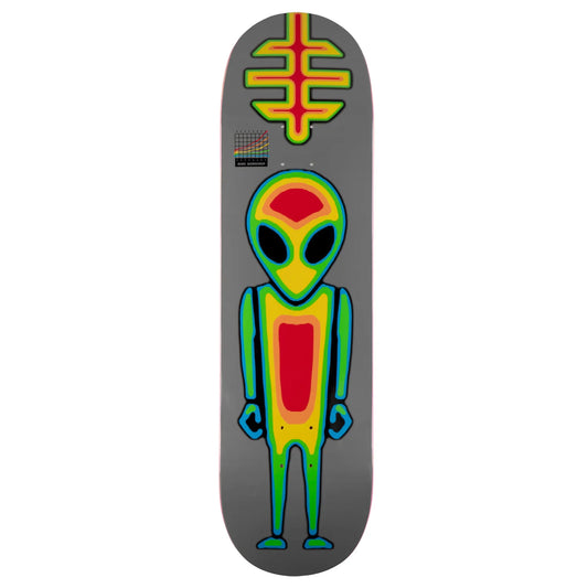 A skateboard deck featuring a gray background with a large retro alien graphic in green, yellow, and red, plus a matching green and yellow symbol near the top.