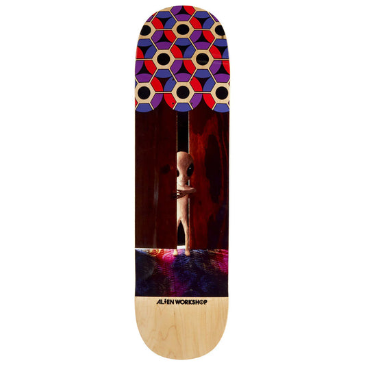 Skateboard deck with geometric pattern and alien design on a white background