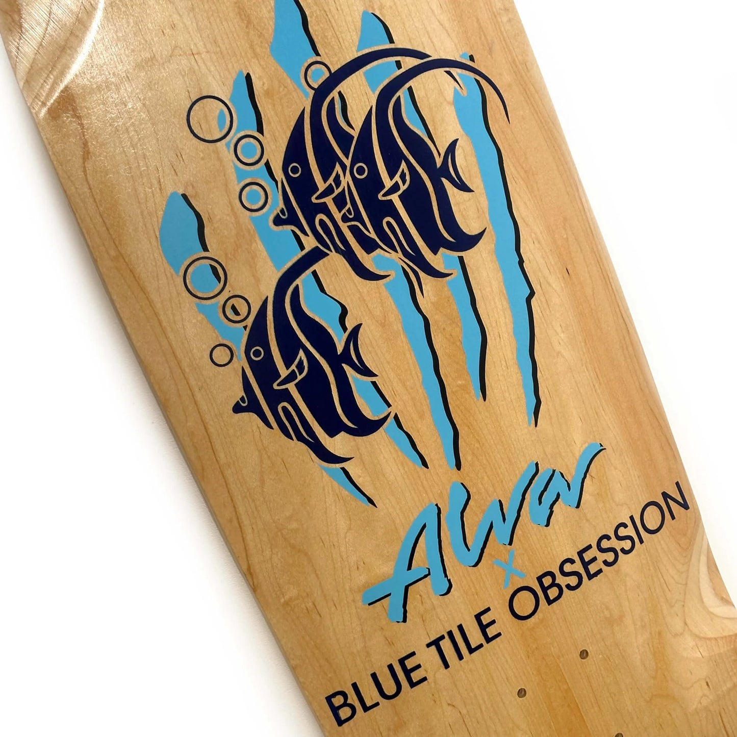 Wooden board with blue and black fish design and 'Alva Blue Tile Obsession' text.