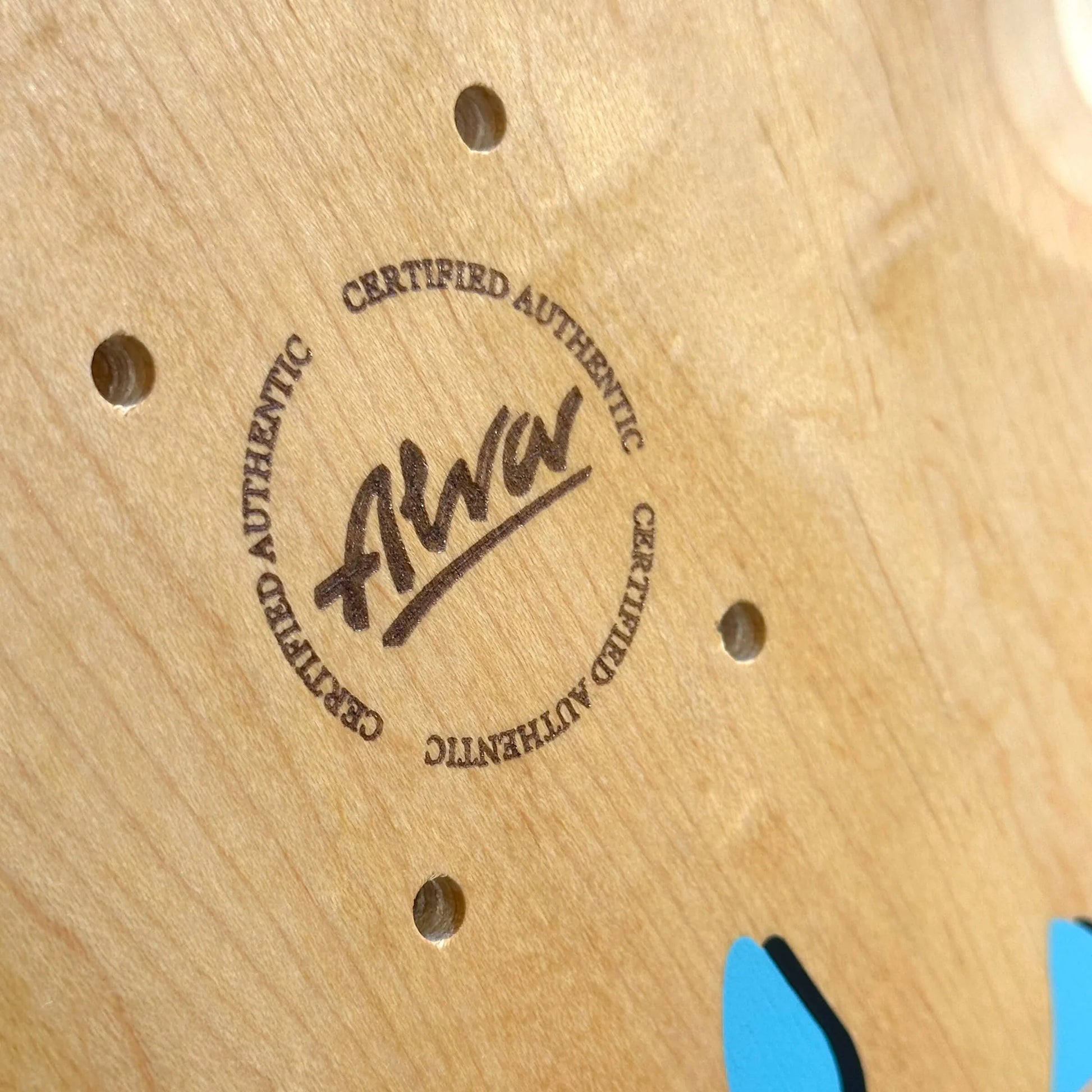 Wooden surface with 'Certified Authentic' stamp and visible brand name.