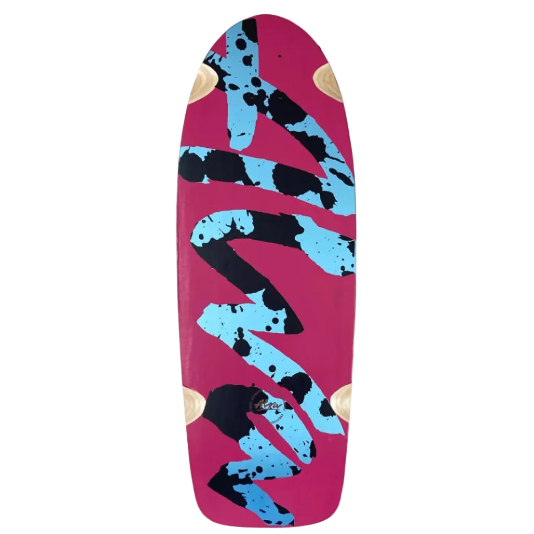 A skateboard deck featuring a vibrant magenta-pink base with a bold abstract design of light blue and black paint splatters and drips, accented with small gold circles near the nose and tail.