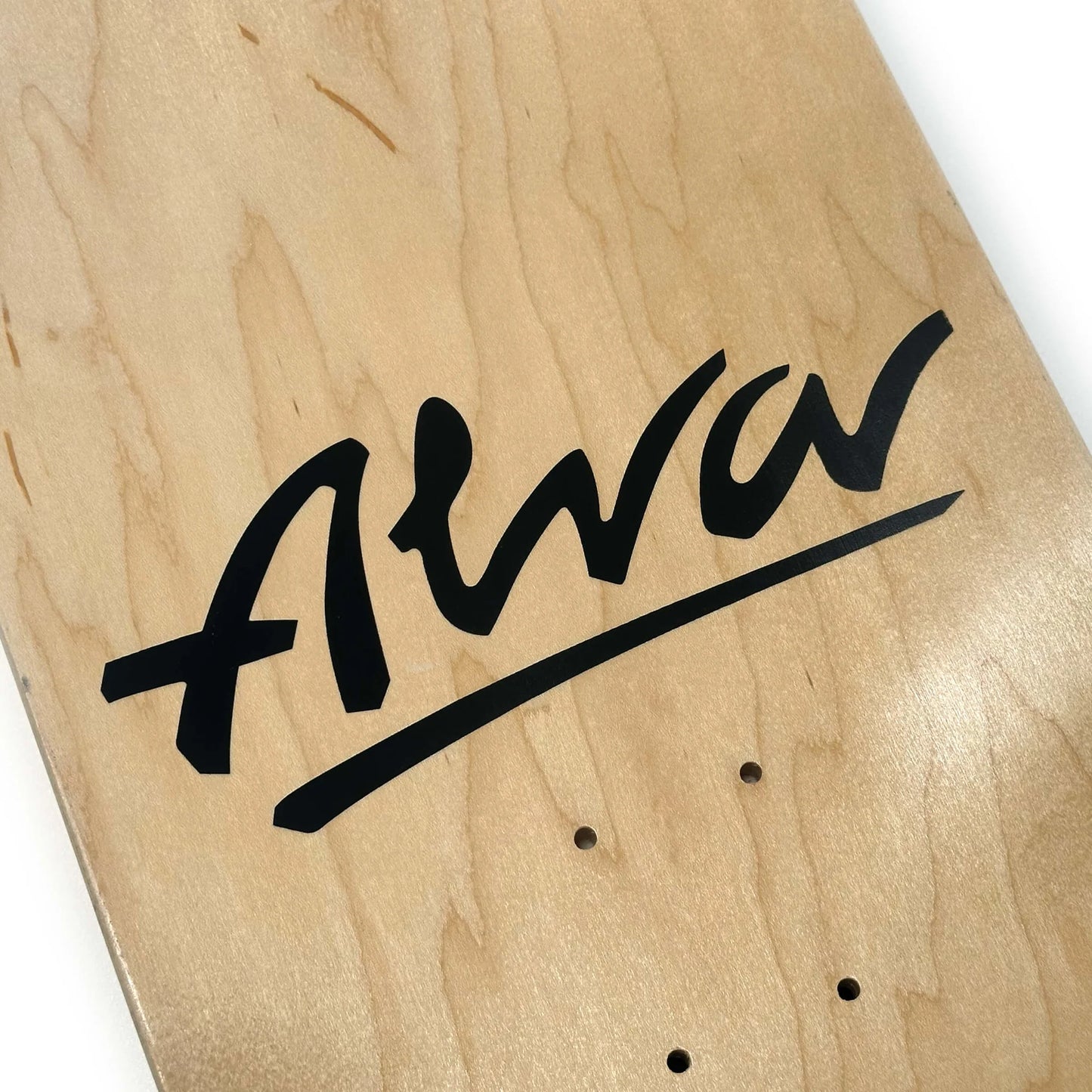Wooden skateboard deck with 'Alva' branding on a white background