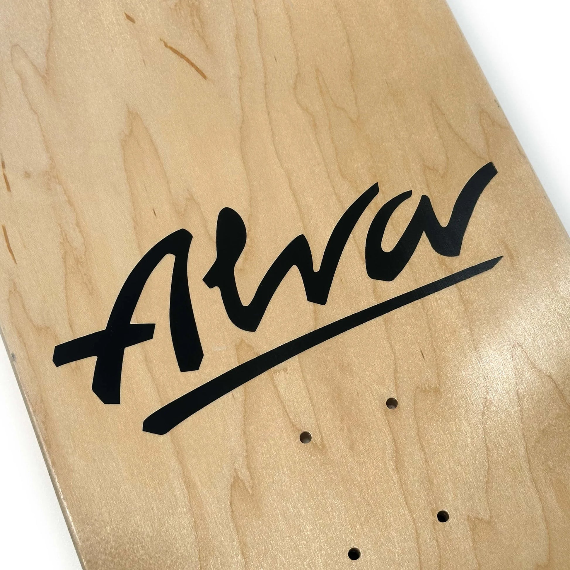 Wooden skateboard deck with 'Alva' branding on a white background