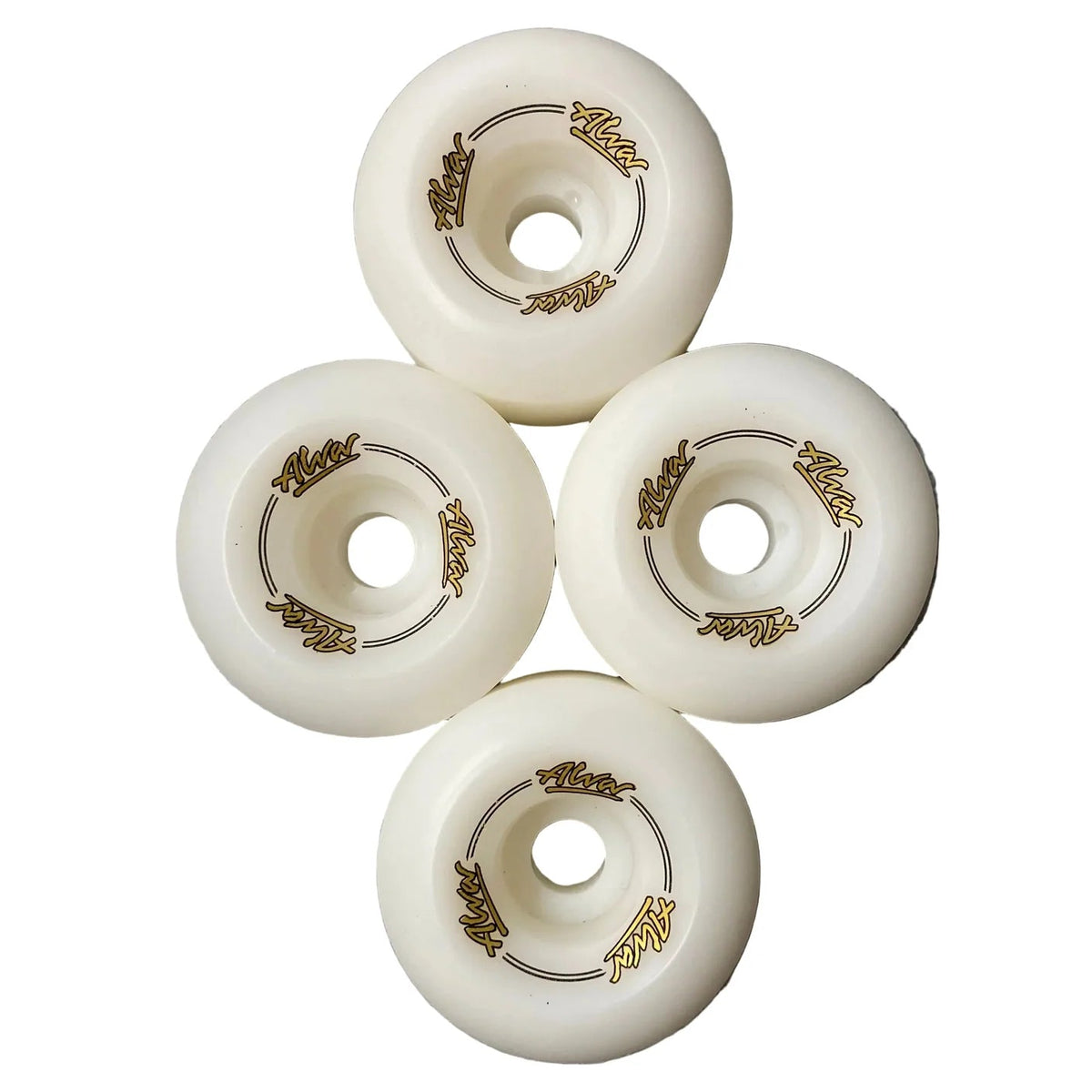 Four white roller skate wheels with gold accents on a gray surface