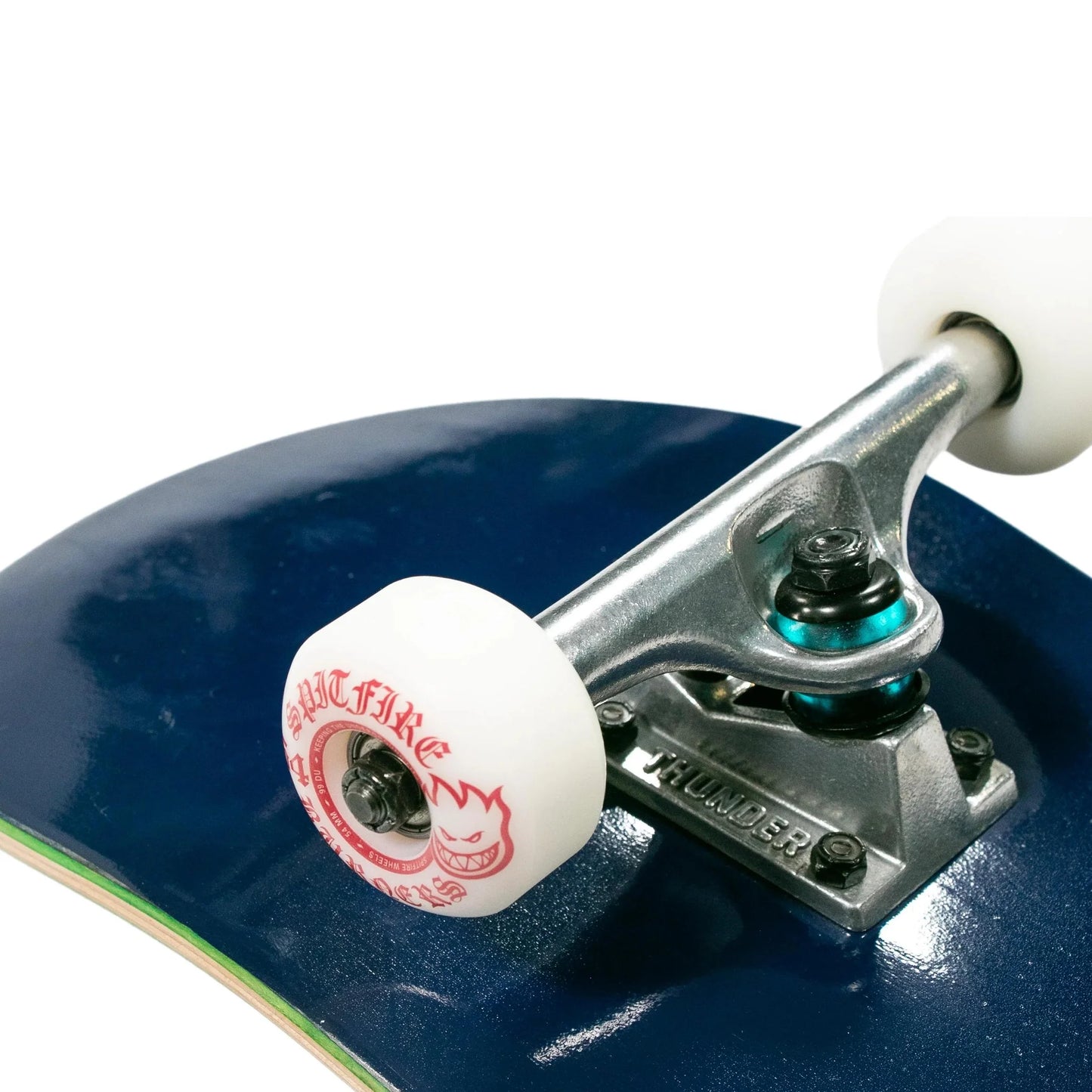 Close-up of a skateboard with a blue deck and white wheels on a white background