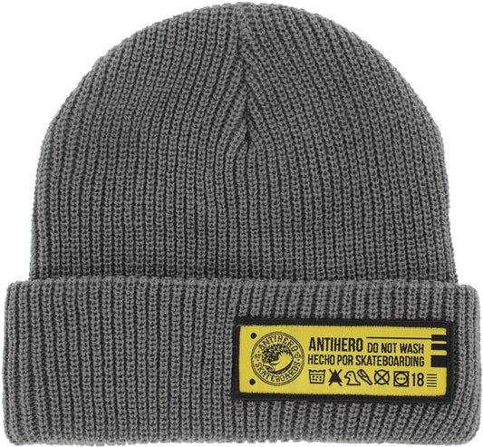 Gray knit beanie with a yellow label on a white background