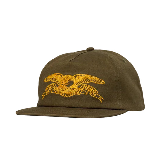 Brown cap with yellow eagle emblem on a white background
