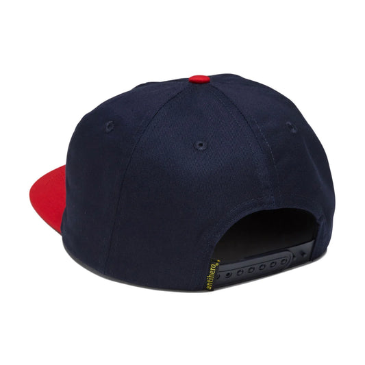 A navy blue snapback cap with a contrasting red flat brim, shown from a rear three-quarter angle on a white background.