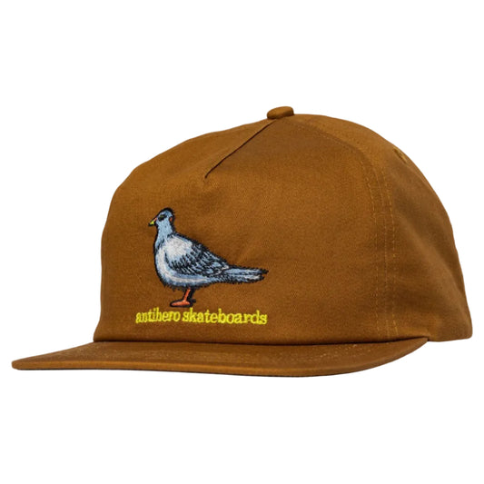 Brown cap with pigeon embroidery and 'othello skateboards' text on a white background