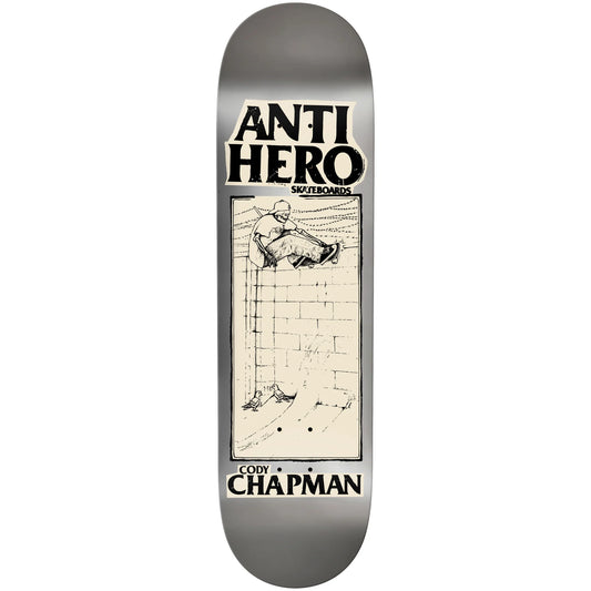 An Anti Hero brand skateboard deck featuring a silver metallic background with a central cream-colored graphic panel containing a black sketch of a skateboarder and the text 'Cody Chapman'.