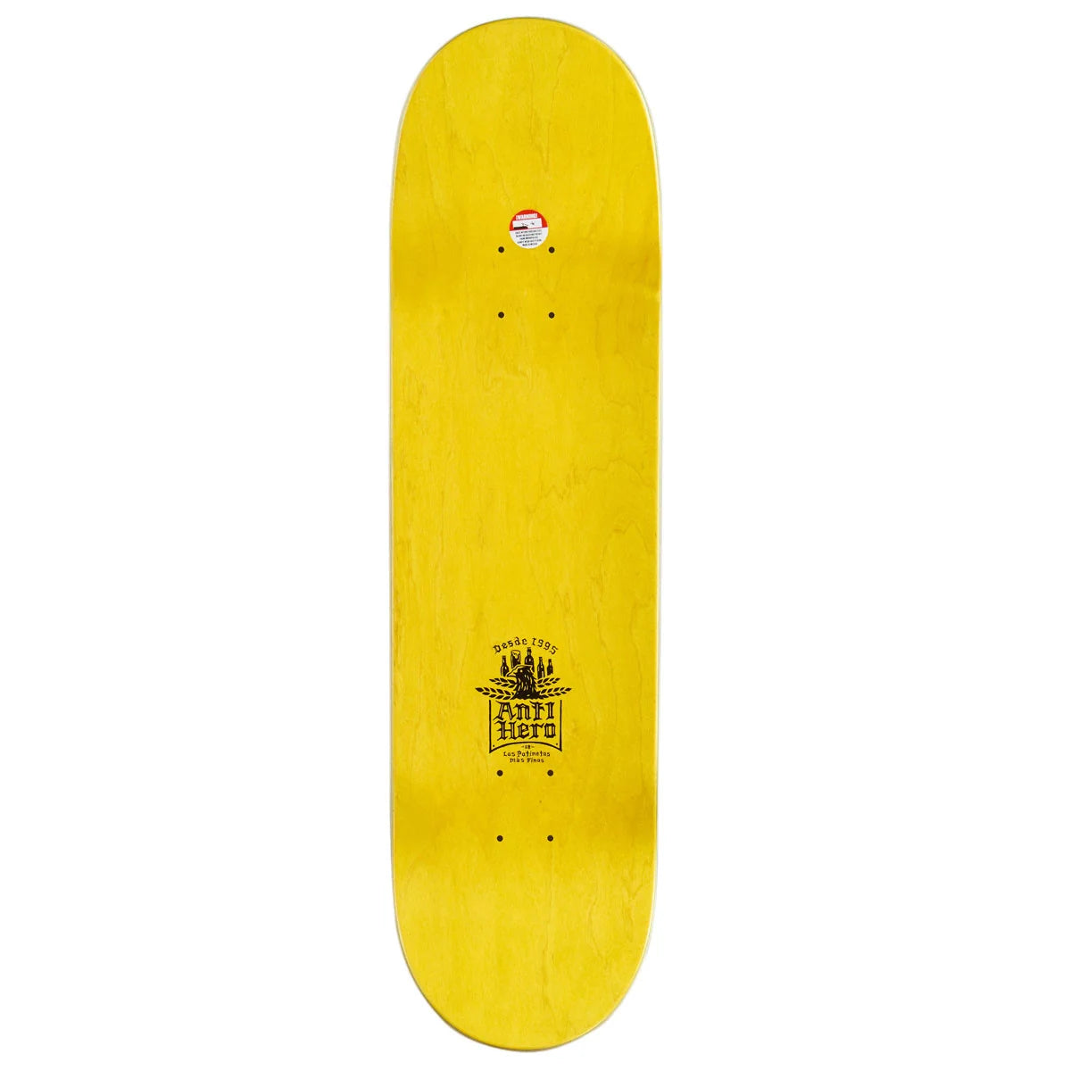 A bright yellow skateboard deck shown vertically against a plain white background, featuring a black graphic logo near the bottom and a small sticker near the top.