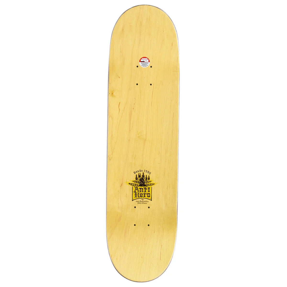 The underside of a skateboard deck made of light natural wood, featuring a yellow and black 'Anti-hero' logo near the center and a small sticker at the nose, shown against a plain white background.