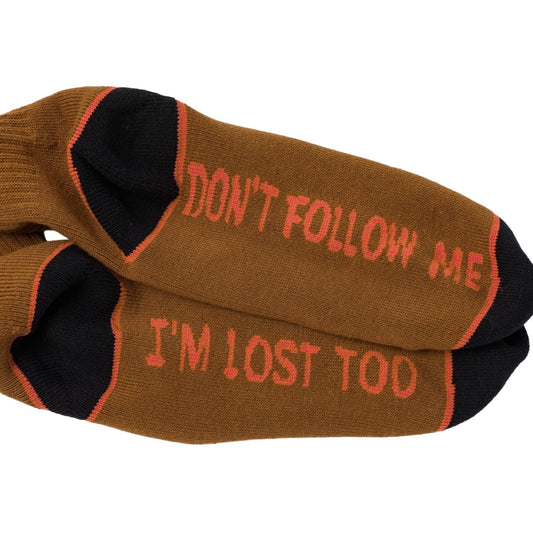 Brown socks with red text 'Don't follow me, I'm lost too' on a white background