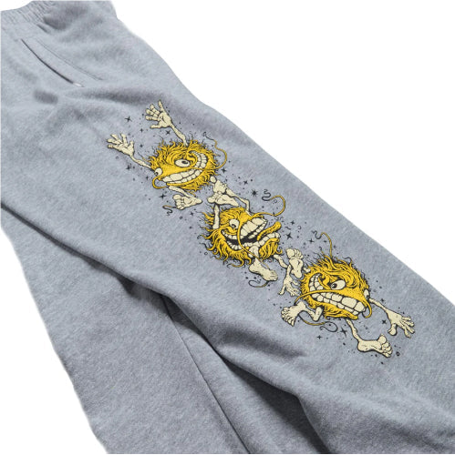 Gray sweatpants with yellow cartoon character design on a white background