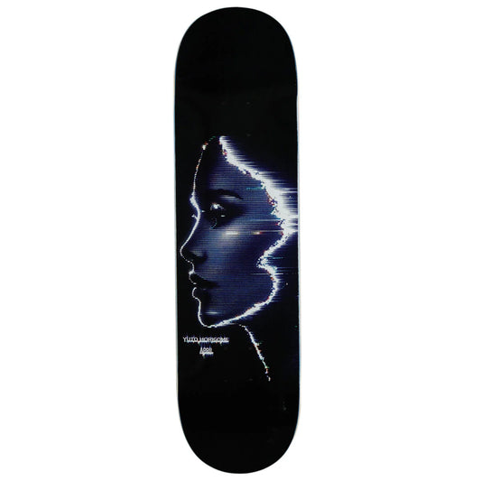 A skateboard deck featuring a black background with a stylized digital graphic of a woman's face in profile, rendered in shades of blue, white, and purple. The text 'Volkswagen' and 'Applause' are printed near the bottom.