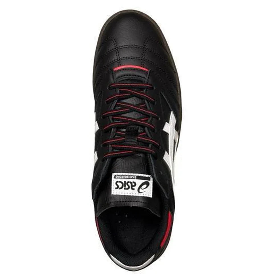 Black sneaker with red accents on a white background