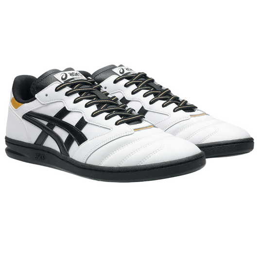 White sneakers with black accents on a gray background