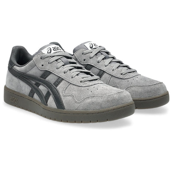Pair of gray sneakers with black accents on a white background