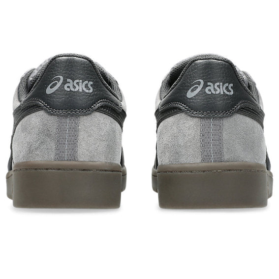 Gray Asics shoes shown from the back on a white background