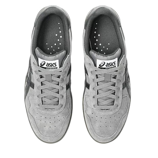 Pair of gray Asics sneakers on a white background