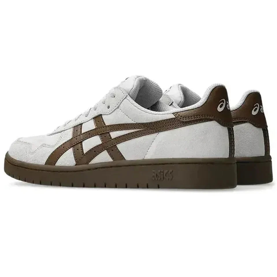 White and brown sneaker with Asics logo on a white background