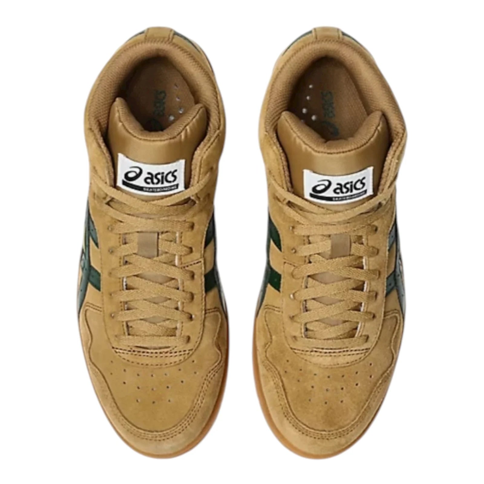 Pair of tan sneakers with green accents on a white background
